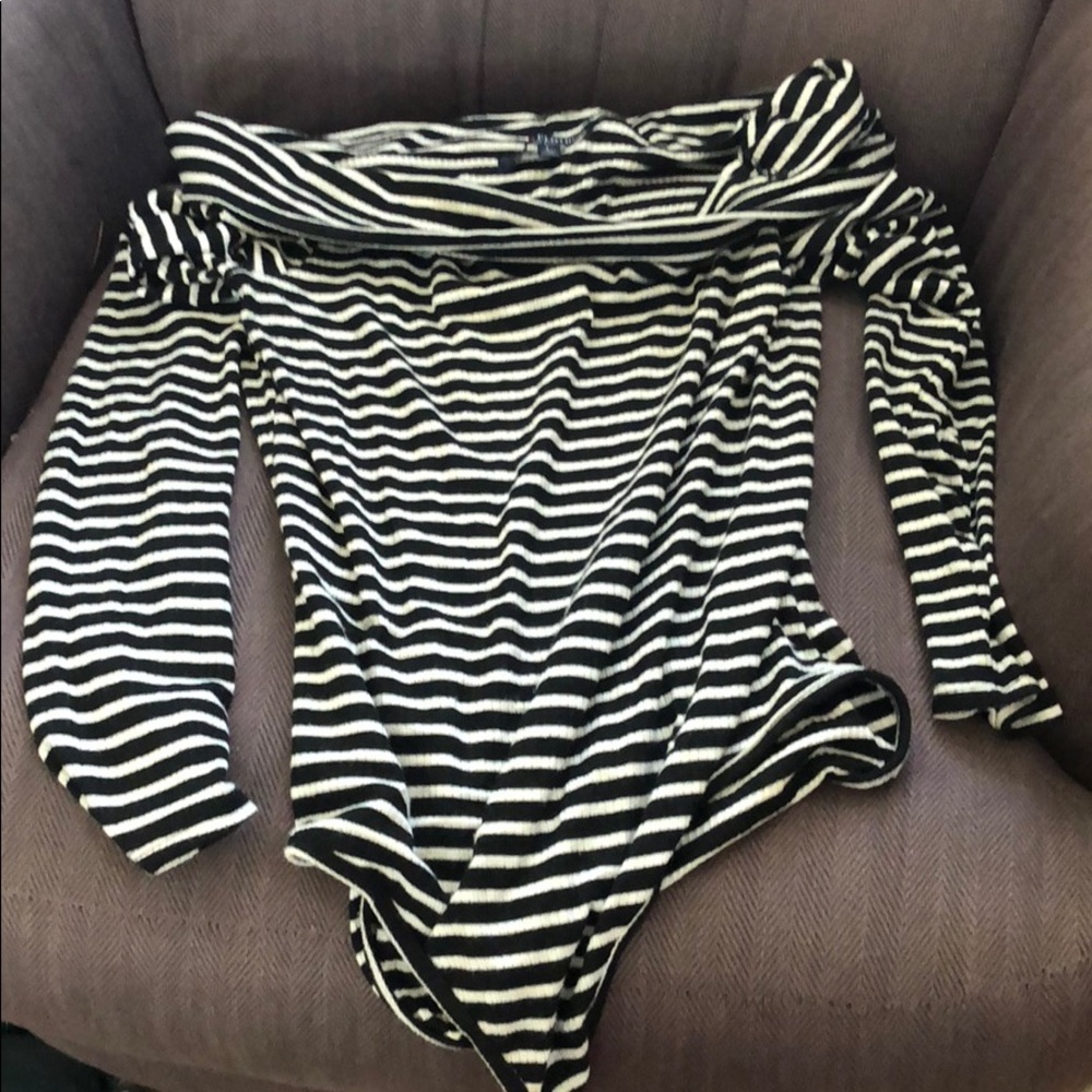 A stripped off the shoulder body suit